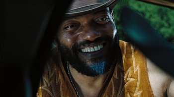 Movie still from “The Devil's Rejects” (2005), directed by Rob Zombie – A person wearing a hat; Close Up shot, Over the shoulder angle