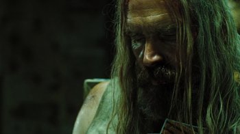 Movie still from “The Devil's Rejects” (2005), directed by Rob Zombie – A man with long hair and a long beard; Close Up shot, Low angle