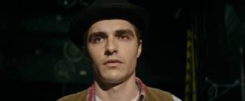 Movie still from “The Disaster Artist” (2017), directed by James Franco – A person wearing a hat; Close Up shot, High angle