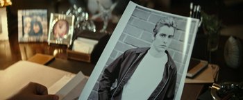 Movie still from “The Disaster Artist” (2017), directed by James Franco – A black and white photo of a man in a jacket; Close Up shot, Over the shoulder angle