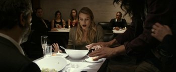 Movie still from “The Disaster Artist” (2017), directed by James Franco – A woman sitting at a table with a bowl of food; Medium shot, Over the shoulder angle