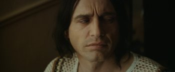 Movie still from “The Disaster Artist” (2017), directed by James Franco – A person with long black hair; Close Up shot, Over the shoulder angle