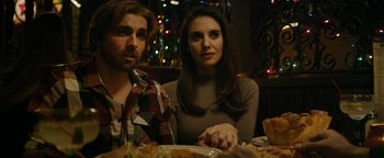 Movie still from “The Disaster Artist” (2017), directed by James Franco – A man and a woman sitting at a dinner table; Close Up shot, Over the shoulder angle