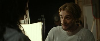 Movie still from “The Disaster Artist” (2017), directed by James Franco – A person wearing a white sweater; Close Up shot, Over the shoulder angle