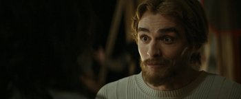 Movie still from “The Disaster Artist” (2017), directed by James Franco – A person with a beard; Close Up shot, Over the shoulder angle