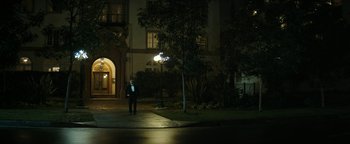 Movie still from “The Disaster Artist” (2017), directed by James Franco – A man in a tuxedo standing on the side of the street; Extreme Wide shot, Low angle