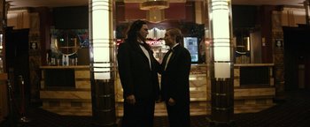 Movie still from “The Disaster Artist” (2017), directed by James Franco – Two men in tuxedos standing next to each other; Medium shot, Low angle