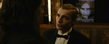 Movie still from “The Disaster Artist” (2017), directed by James Franco – A man in a tuxedo looking at another man in a suit; Close Up shot, Over the shoulder angle