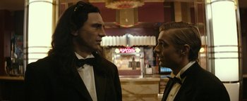 Movie still from “The Disaster Artist” (2017), directed by James Franco – A man and a woman standing next to each other in front of a movie theater; Medium shot, Over the shoulder angle