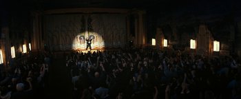 Movie still from “The Disaster Artist” (2017), directed by James Franco – A crowd of people in front of a stage; Extreme Wide shot, High angle