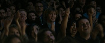 Movie still from “The Disaster Artist” (2017), directed by James Franco – A crowd of people are watching a performance; Close Up shot, Over the shoulder angle