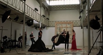 Movie still from “The Diving Bell and the Butterfly” (2007), directed by Julian Schnabel – A group of people standing in a room; Wide shot, Low angle