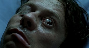 Movie still from “The Diving Bell and the Butterfly” (2007), directed by Julian Schnabel – A person's eyes and nose; Extreme Close Up shot, Overhead angle