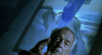 Movie still from “The Diving Bell and the Butterfly” (2007), directed by Julian Schnabel – An older man is looking at a painting; Close Up shot, Low angle