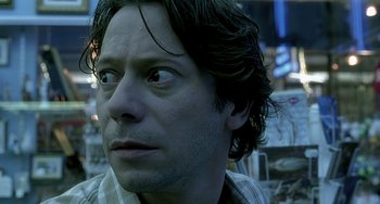 Movie still from “The Diving Bell and the Butterfly” (2007), directed by Julian Schnabel – A person looking at the camera; Close Up shot, Low angle