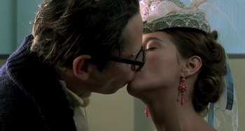 Movie still from “The Diving Bell and the Butterfly” (2007), directed by Julian Schnabel – A man and a woman kissing in front of a mirror; Close Up shot, Over the shoulder angle