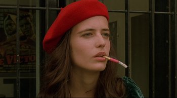 Movie still from “The Dreamers” (2003), directed by Bernardo Bertolucci – A woman in a red beret is smoking a cigarette; Close Up shot, Low angle