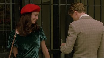 Movie still from “The Dreamers” (2003), directed by Bernardo Bertolucci – A man and a woman looking at a cell phone; Medium shot, Over the shoulder angle
