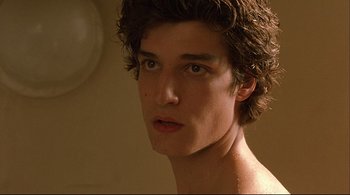 Movie still from “The Dreamers” (2003), directed by Bernardo Bertolucci – A young man's face in front of a mirror; Close Up shot, Low angle