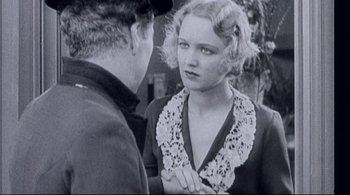 Movie still from “The Dreamers” (2003), directed by Bernardo Bertolucci – An old photo of a man and a woman talking to each other; Close Up shot, Over the shoulder angle