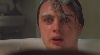 Movie still from “The Dreamers” (2003), directed by Bernardo Bertolucci – A person with a towel on their head; Close Up shot, Low angle