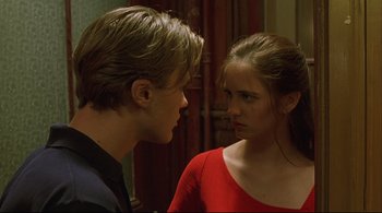 Movie still from “The Dreamers” (2003), directed by Bernardo Bertolucci – A man and a woman looking at one another; Close Up shot, Over the shoulder angle