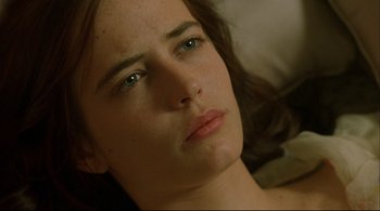 Movie still from “The Dreamers” (2003), directed by Bernardo Bertolucci – A woman's face with green eyes; Close Up shot, High angle