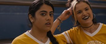 Movie still from “Plan B” (2021), directed by Natalie Morales – A girl is getting her hair combed by another girl; Close Up shot, Over the shoulder angle