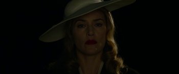 Movie still from “The Dressmaker” (2015), directed by Jocelyn Moorhouse – A person wearing a white hat; Close Up shot, Low angle