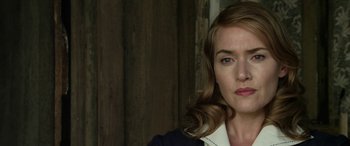 Movie still from “The Dressmaker” (2015), directed by Jocelyn Moorhouse – A person wearing a dress shirt; Close Up shot, Over the shoulder angle