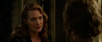 Movie still from “The Dressmaker” (2015), directed by Jocelyn Moorhouse – A person talking to another person; Close Up shot, Over the shoulder angle