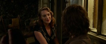 Movie still from “The Dressmaker” (2015), directed by Jocelyn Moorhouse – A woman sitting in front of another woman in front of a mirror; Close Up shot, Over the shoulder angle
