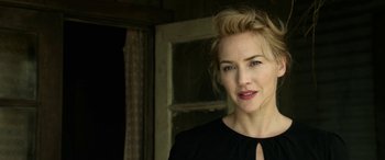 Movie still from “The Dressmaker” (2015), directed by Jocelyn Moorhouse – A person wearing a black shirt; Close Up shot, Low angle