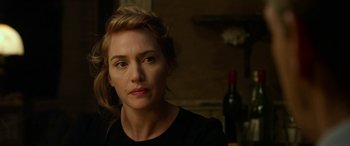 Movie still from “The Dressmaker” (2015), directed by Jocelyn Moorhouse – A person wearing a black shirt; Close Up shot, Over the shoulder angle