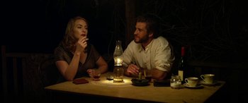 Movie still from “The Dressmaker” (2015), directed by Jocelyn Moorhouse – A man and a woman sitting at a table; Medium shot, Over the shoulder angle