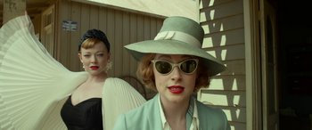 Movie still from “The Dressmaker” (2015), directed by Jocelyn Moorhouse – A woman in a green hat and a woman in a white hat; Close Up shot, Low angle