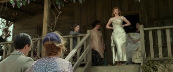 Movie still from “The Dressmaker” (2015), directed by Jocelyn Moorhouse – A group of women standing on a wooden porch; Medium shot, Low angle