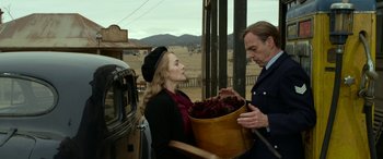 Movie still from “The Dressmaker” (2015), directed by Jocelyn Moorhouse – A man and a woman standing next to each other; Medium shot, Over the shoulder angle
