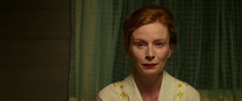Movie still from “The Dressmaker” (2015), directed by Jocelyn Moorhouse – A person with red hair; Close Up shot, High angle