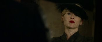 Movie still from “The Dressmaker” (2015), directed by Jocelyn Moorhouse – A person wearing a hat; Close Up shot, Over the shoulder angle
