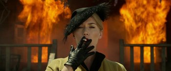 Movie still from “The Dressmaker” (2015), directed by Jocelyn Moorhouse – A woman wearing a black hat and black leather gloves; Close Up shot, Low angle