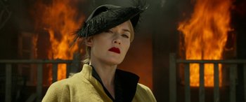 Movie still from “The Dressmaker” (2015), directed by Jocelyn Moorhouse – A woman wearing a black hat with a feather on it; Close Up shot, Low angle