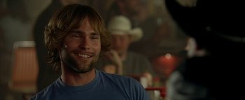 Movie still from “The Dukes of Hazzard” (2005), directed by Jay Chandrasekhar – A person with a cowboy hat on; Close Up shot, Over the shoulder angle
