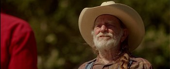 Movie still from “The Dukes of Hazzard” (2005), directed by Jay Chandrasekhar – An old man with a beard wearing a cowboy hat; Close Up shot, Low angle