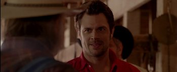 Movie still from “The Dukes of Hazzard” (2005), directed by Jay Chandrasekhar – A person wearing a red shirt; Close Up shot, Over the shoulder angle