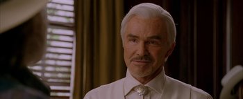 Movie still from “The Dukes of Hazzard” (2005), directed by Jay Chandrasekhar – A man that is wearing a white shirt and tie; Close Up shot, Low angle