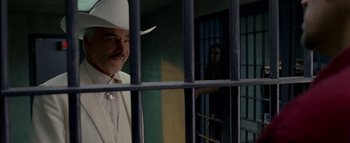 Movie still from “The Dukes of Hazzard” (2005), directed by Jay Chandrasekhar – A man and a woman behind bars in a jail cell; Medium shot, Over the shoulder angle