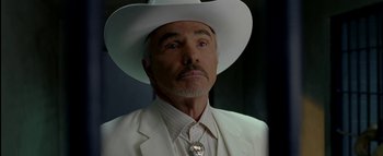 Movie still from “The Dukes of Hazzard” (2005), directed by Jay Chandrasekhar – A person wearing a white hat; Close Up shot, Low angle