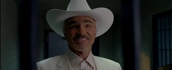 Movie still from “The Dukes of Hazzard” (2005), directed by Jay Chandrasekhar – A person wearing a white hat; Close Up shot, Low angle