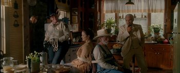 Movie still from “The Dukes of Hazzard” (2005), directed by Jay Chandrasekhar – A group of people tied to a chair in a room; Wide shot, Over the shoulder angle